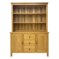 Oak kitchen dresser, raised two-tier back over three drawers and double cupboard