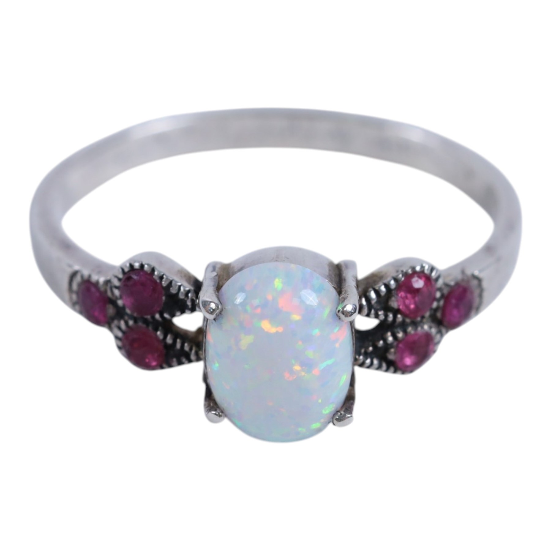 Pair of silver opal stud earrings, pair of silver blue opal stud earrings, pair of silver rose gilt cubic zirconia hoop earrings, silver ruby and opal ring, and silver gilt tourmaline ring