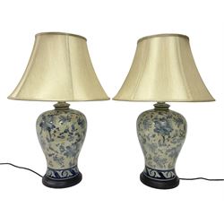 Pair of table lamps of baluster form, decorated with stylised flowers upon a mottled ground, with shade H68cm