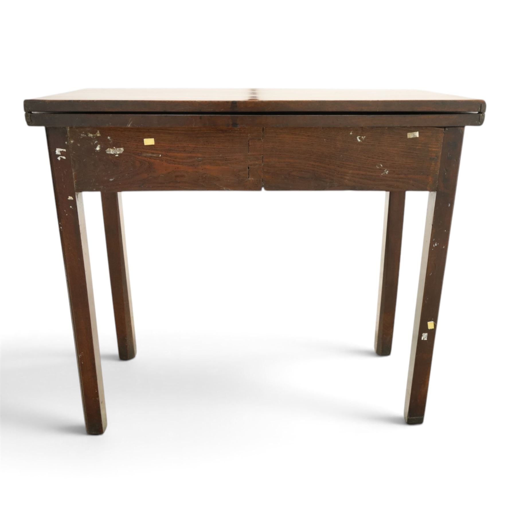 Georgian oak tea table, rectangular fold-over top above single frieze drawer with brass swing handle, shaped apron, gateleg raised on square tapering supports