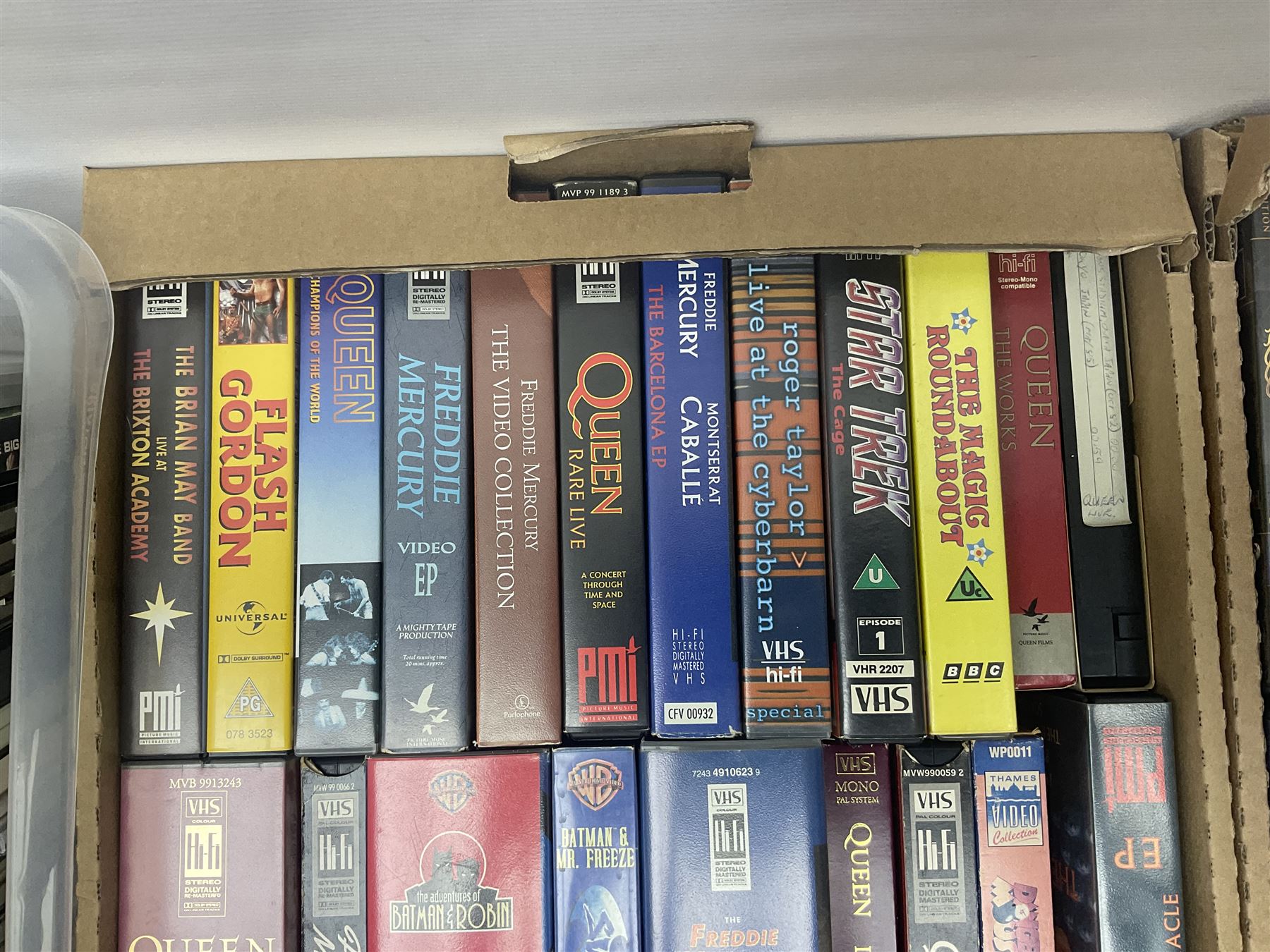 Large collection of VHS tapes, DVDS, CDs to include Queen, James Bond 007, Batman etc, in three boxes