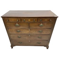 Early 19th century mahogany chest, three shallow frieze drawers over two short and three long cock-beaded drawers, canted corners with reeded moulded square columns, on ogee bracket feet
