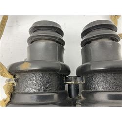 Pair of WWII German U-boat binoculars probably 7 x 50 by Leitz, with rubber eye piece protector covers and leather case stamped with Kriegsmarine mark to the lid and dated 1944, with leather strap.