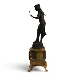 French green onyx clock, surmounted by a female figure amongst rushes, the enamel clock face with floral sprigs, H74cm 