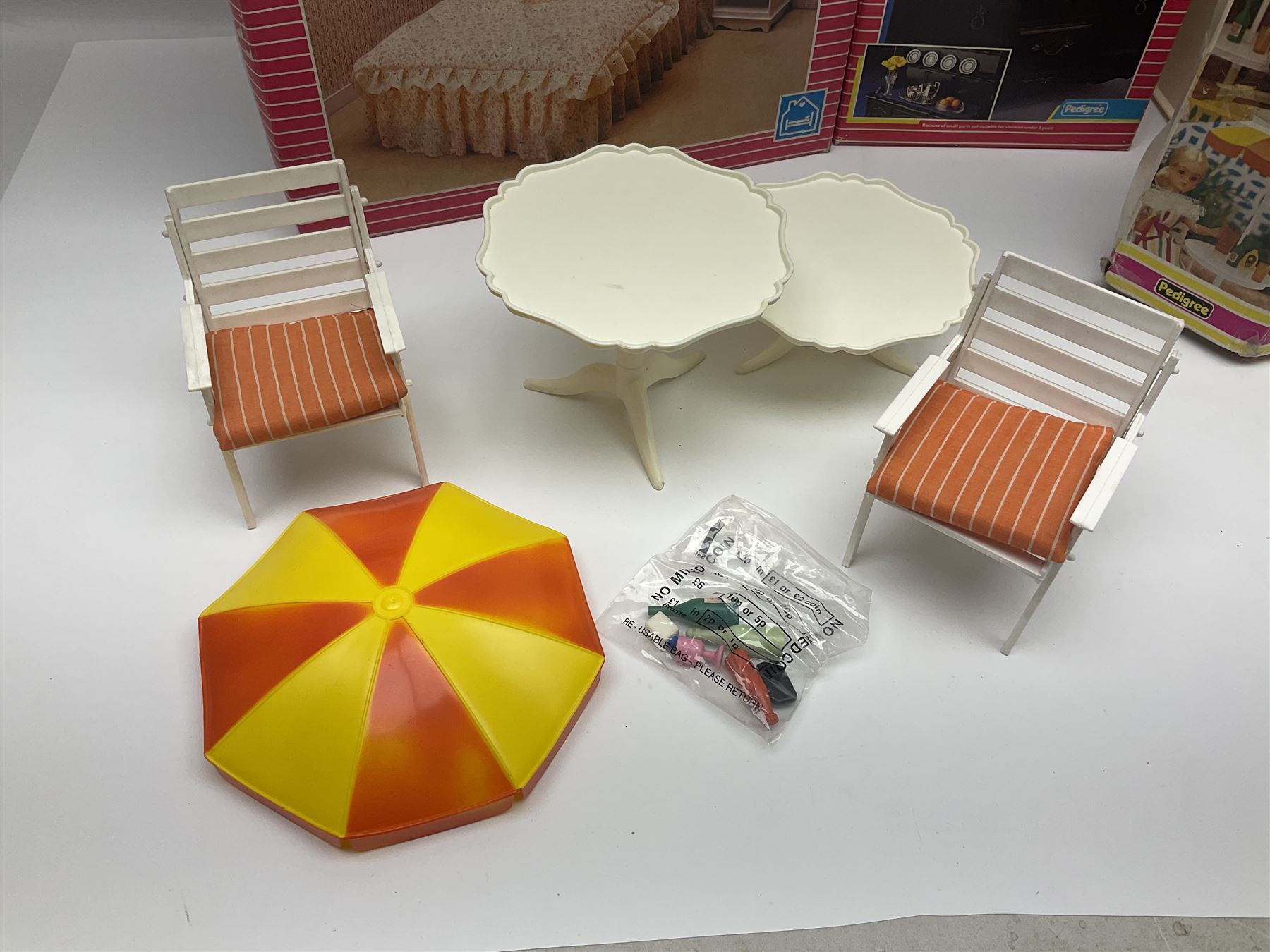 Sindy - furniture and accessories comprising dining suite with separate dresser; two beds; Garden Set; Music Centre; all  boxed; three-piece bedroom suite; settee; Hostess Trolley; two coffee tables; and four-piece bathroom suite including shower cubicle