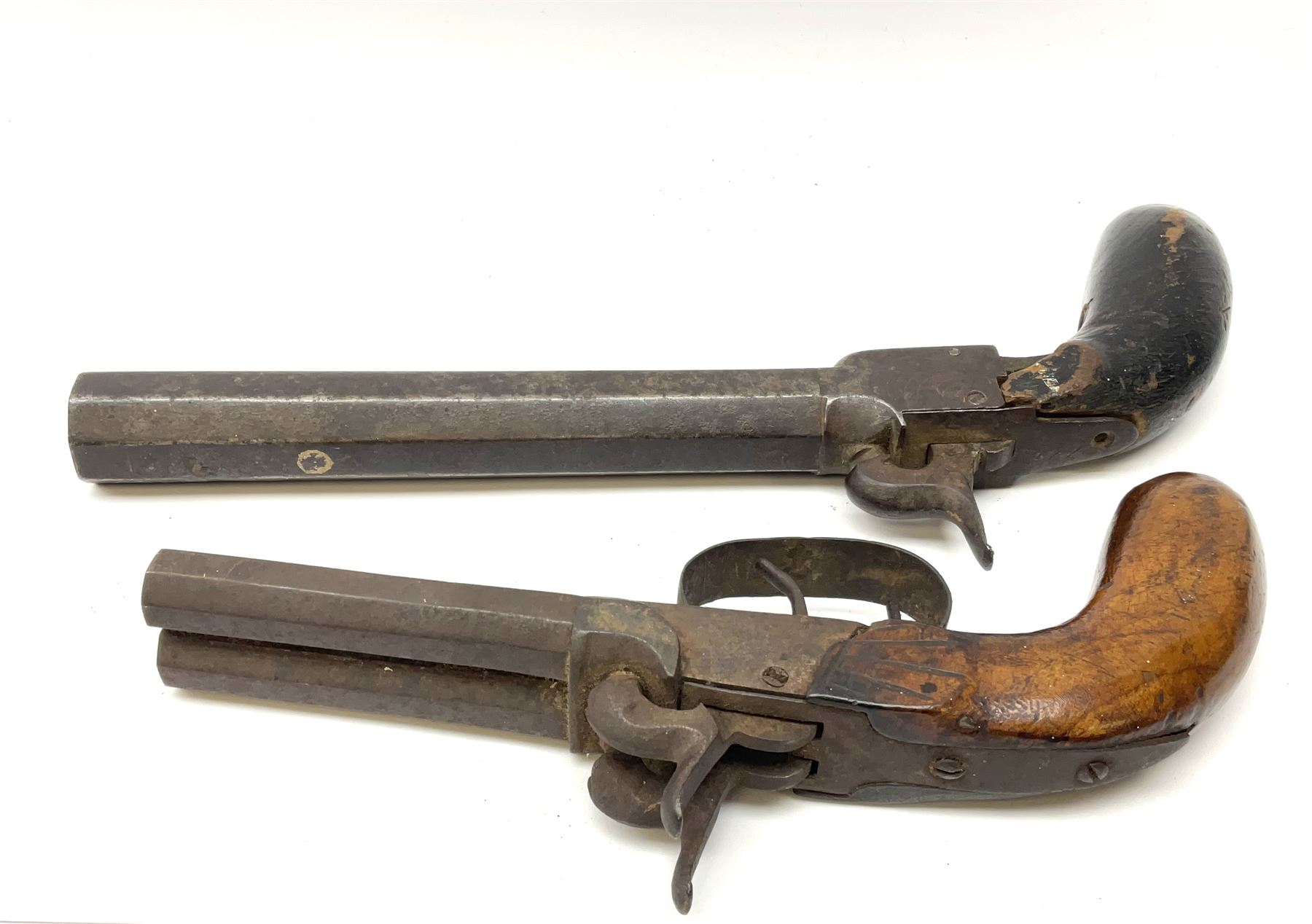 Mid-19th century percussion cap side-by-side double barrel pocket pistol with 7.5cm octagonal barrels and walnut bag stock L21.5cm; and Belgian 16-bore percussion cap pocket pistol with 16cm octagonal barrel, folding trigger and black painted wooden stock L27.5cm (2)