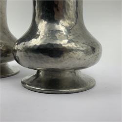 Pair of Liberty & Co Tudric pewter vases, each of bellied form with hammered finish, upon a circular spreading foot, impressed beneath 0987, H12cm