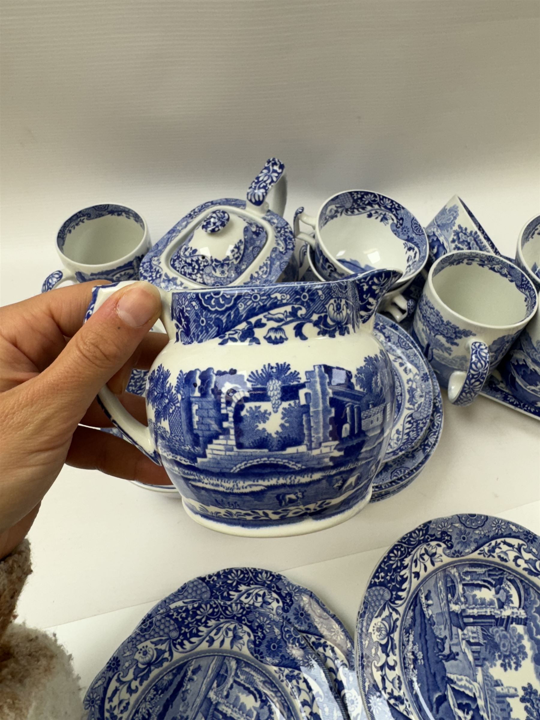 Spode Italian pattern tea service, comprising teapot, milk jug, open sucrier, six cups and saucers, two coffee cans and saucers, six dessert plates, four mugs and a sandwich plate (30) 