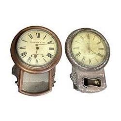 Two drop dial wall clocks. One with an English fusee movement and another with an 
American twin train going barrel movement.