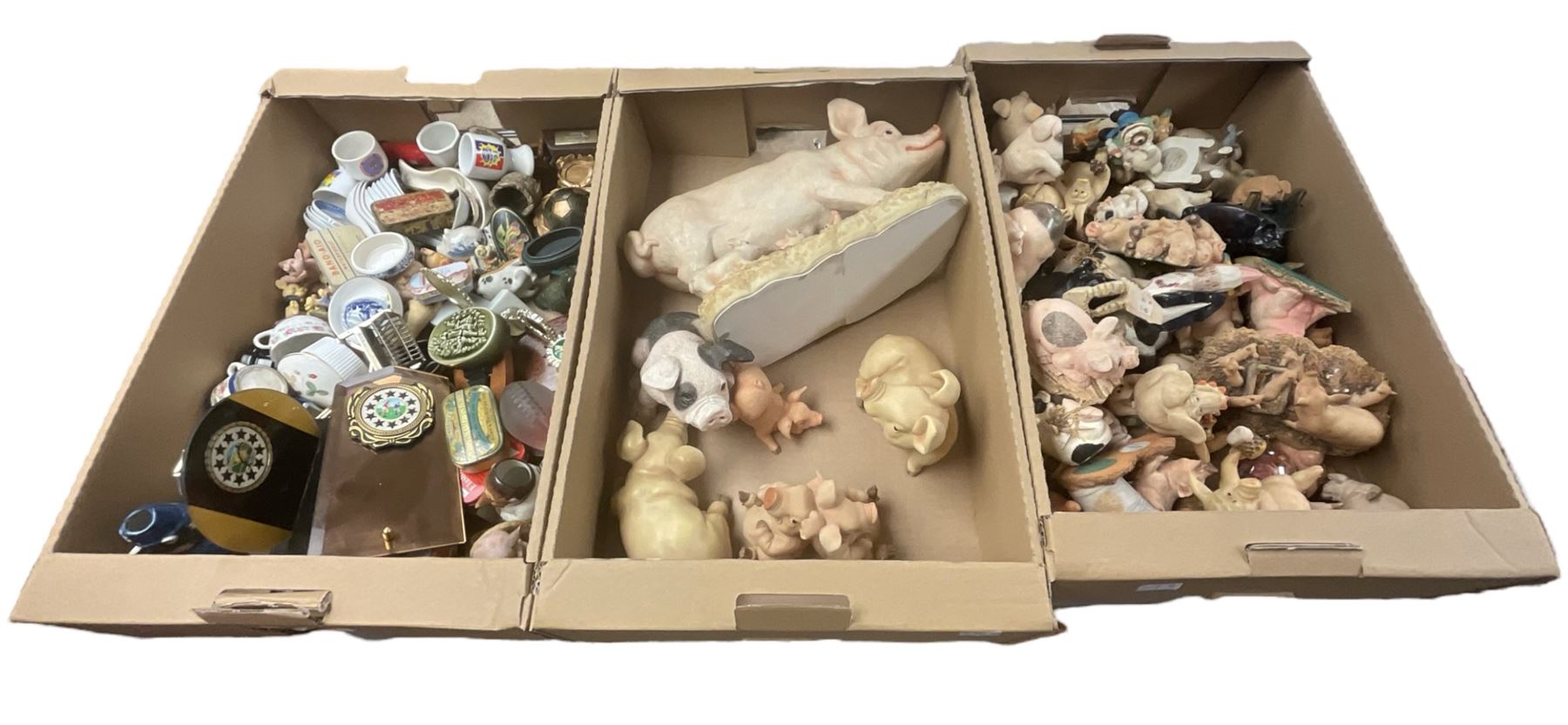 Collection of model pigs, Staffordshire Woodland Collection figures, trophies etc in three boxes