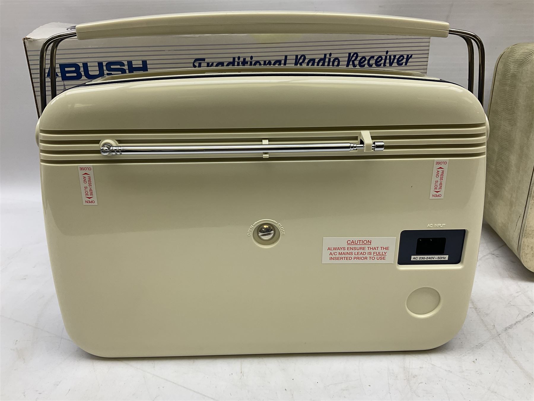 1950s Pye Type P43 cabinet radio in cream Bakelite case with orange knobs, W30cm H22cm D16cm, together with Ever Ready Sky Queen portable radio, Ekco portable radio in red case, Boxed Bush Special Edition 2002 Queens Golden Jubilee radio, Hacker Herald VHS radio (5)