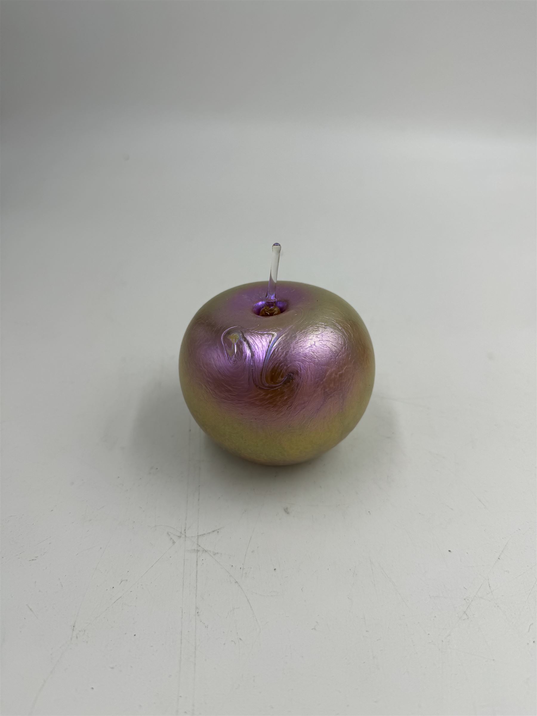 Three Okra scent bottles, each decorated with iridescent patterns on a pink ground, including perfume apple, all with original boxes, from Richard P Golding Studio 