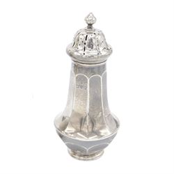 Two early 20th century silver sugar casters, the first an Edwardian example of faceted urn form, hallmarked Sibray, Hall & Co Ltd, London 1910, the second a 1920s example of typical urn form, upon a stepped circular filled base, hallmarked William Neale & Son Ltd, Birmingham 1925, tallest H20cm