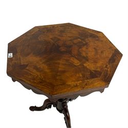 Victorian figured mahogany tripod table, octagonal top with segmented highly figured veneers over pointed arch frieze rails, on turned egg and dart carved pedestal with lappet carved baluster, three splayed and C-scroll carved supports with scrolled terminals