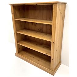 Pine bookcase, three shelves, platform base