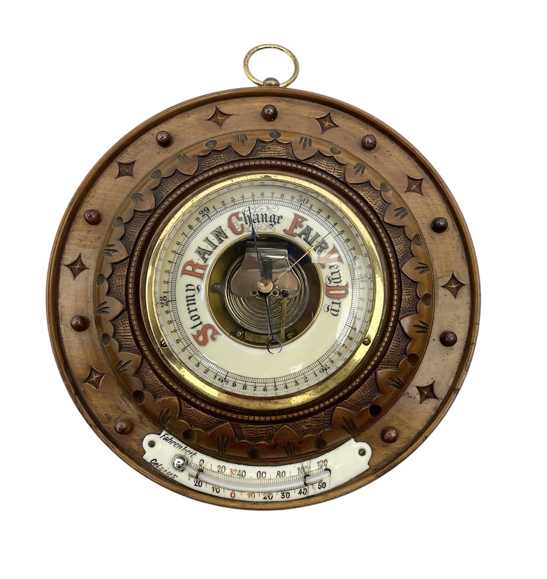 German- Late 19th century aneroid Barometer in a carved mahogany case with pendants and finials, 4” open dial register and mercury thermometer, with another early Edwardian aneroid barometer in a circular carved  walnut case with a 4