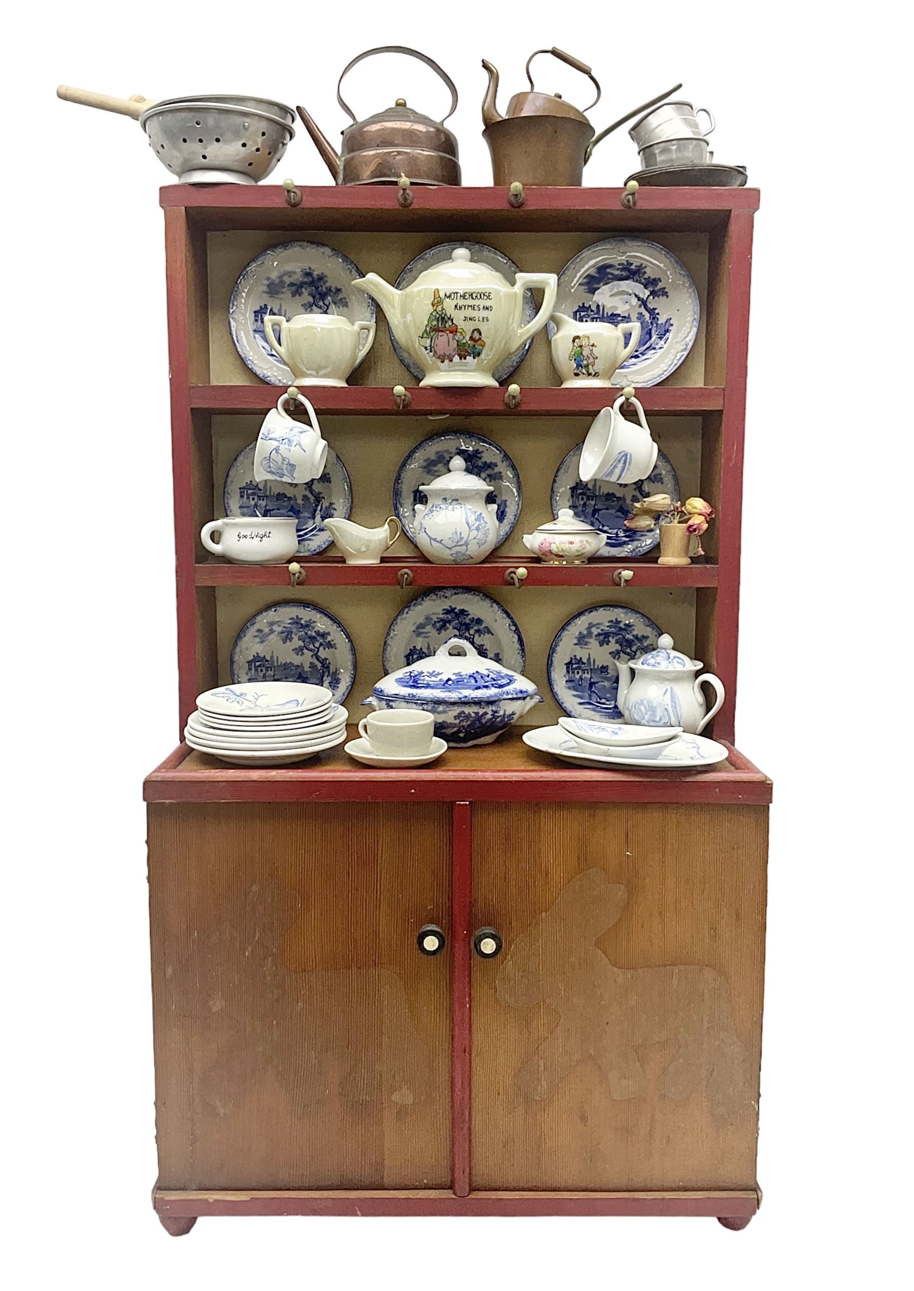 Miniature pitch pine Welsh dresser with open plate rack over two cupboard doors, displayed with Ridgways Humphrey's Clock pattern and other doll's blue/white tea ware, copper kettles and pan etc W41cm H72cm