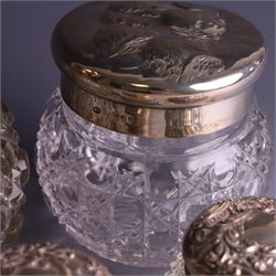 Early 20th century silver mounted cut glass scent bottle, with silver lid and three cut glass dressing table jars with silver lids, all hallmarked 