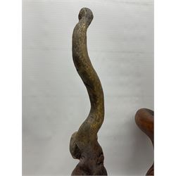 Helen Skelton (British 1933 – 2023): Three carved wooden abstract sculptures, each modelled as a cat, with carved or painted features, largest H63cm. Born into an RAF family in 1933 in Kent and travelled the world extensively during her childhood. After settling in Bridlington, Helen immersed herself in painting, textiles, and wood sculpture, often inspired by nature's beauty. Her talent was showcased in a one-woman show at Sewerby Hall and recognised with the sculpture prize at Ferens Art Gallery in 2000. Sadly, Helen’s daughter passed away from cancer in 2005. This loss inspired Helen to donate her sculptures to Marie Curie upon her passing in 2023.