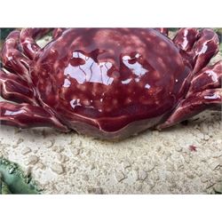 Two 20th Century Portuguese Palissy style Majolica wall plates, one depicting a crab, the other a lobster each to the centre modelled in relief surrounded by encrustations and shells, both with impress marks beneath, D32cm