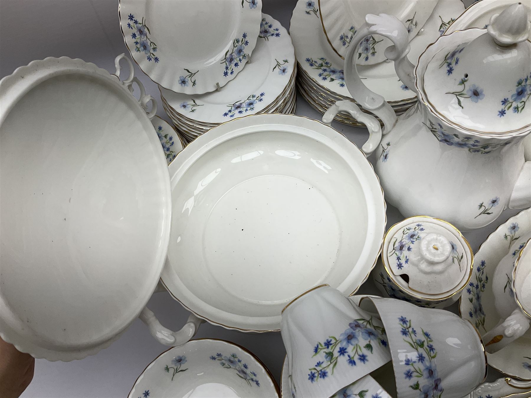 Extensive Richmond Blue Rock pattern part tea and dinner service, to include seven dinner plates, nine smaller plates, three lidded twin handled tureens, two teapots and two coffee pots, eleven bowls, cake stand, six twin handled soup bowls and saucers, six teacups, four coffee cups, milk jugs, sucrier, cake plate, salt and pepper shakers, other plates, dishes, bowls, side plates and many spares etc