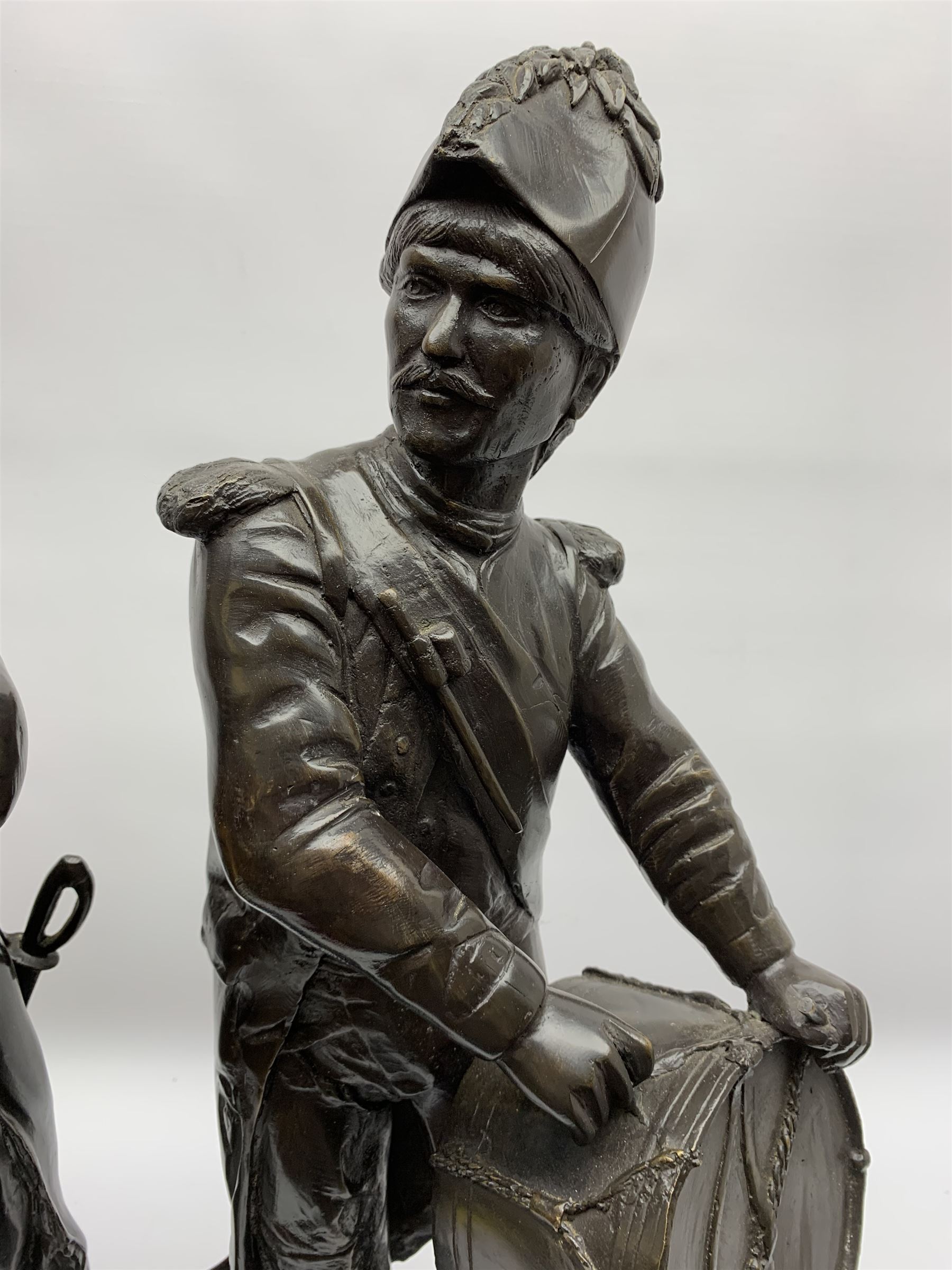 After Etienne-Henri Dumaige (1830-1888): 'Avant de Combat Volontaire de 1792' and 'Apres de Combat Grenaider de 1792', pair of large bronze figures modelled as French Revolutionary soldiers, each upon rectangular stepped black marble base, signed E H Dumaige, Paris 1888, tallest example H68.5cm