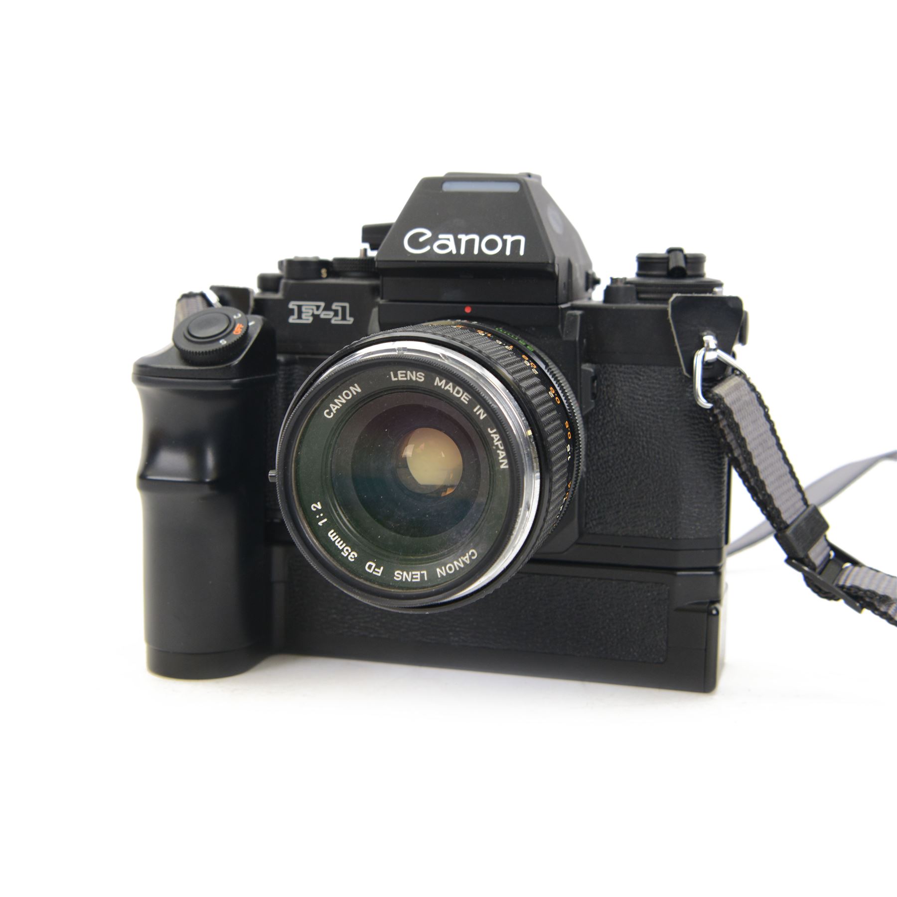 Canon F1 camera body, serial no. 223511, with 'Canon FD 35mm 1:2 FD' lens, serial no.23164, shoulder strap and Canon AE Power winder, serial no.174705