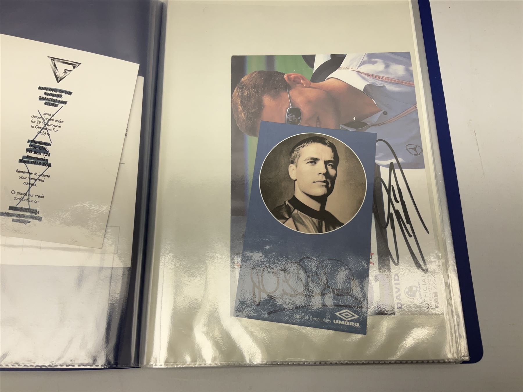 Two folders of over fifty photographs, cards, compliment slips etc of actors, actresses, celebrities, politicians, sports personalities etc, all bearing signatures, including David Frost, Lloyd Grosman, John Suchet, Julia Somerville and othe GMTV presenters, Carol Vorderman, Jackie Collins, Rolf Harris, Timothy Dalton, Pete Postlethwaite, Magnus magnusson, John Major, Kate Moss, Uri Geller, David Beckham, Peter Alliss, Sharon Davies, Kevin Keegan etc