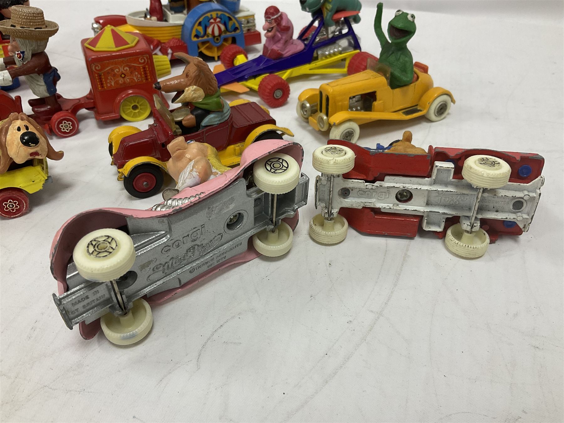 Corgi/Dinky - twelve unboxed and playworn TV/Film related die-cast models including Popeye Paddle Wagon; Dick Dastardly; Magic Roundabout; Muppets; Basil Brush; and Noddy (12)