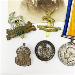 WW1 pair of medals comprising British War Medal and Victory Medal awarded to 1708 Pte.J.A. Hankins Hunts.Cyc.Bn.; two cap badges for Huntingdonshire and Royal Warwickshire 1st Birmingham Battalion; silver ARP badge; and Services Rendered badge No.B748 with photograph of recipient wearing it.