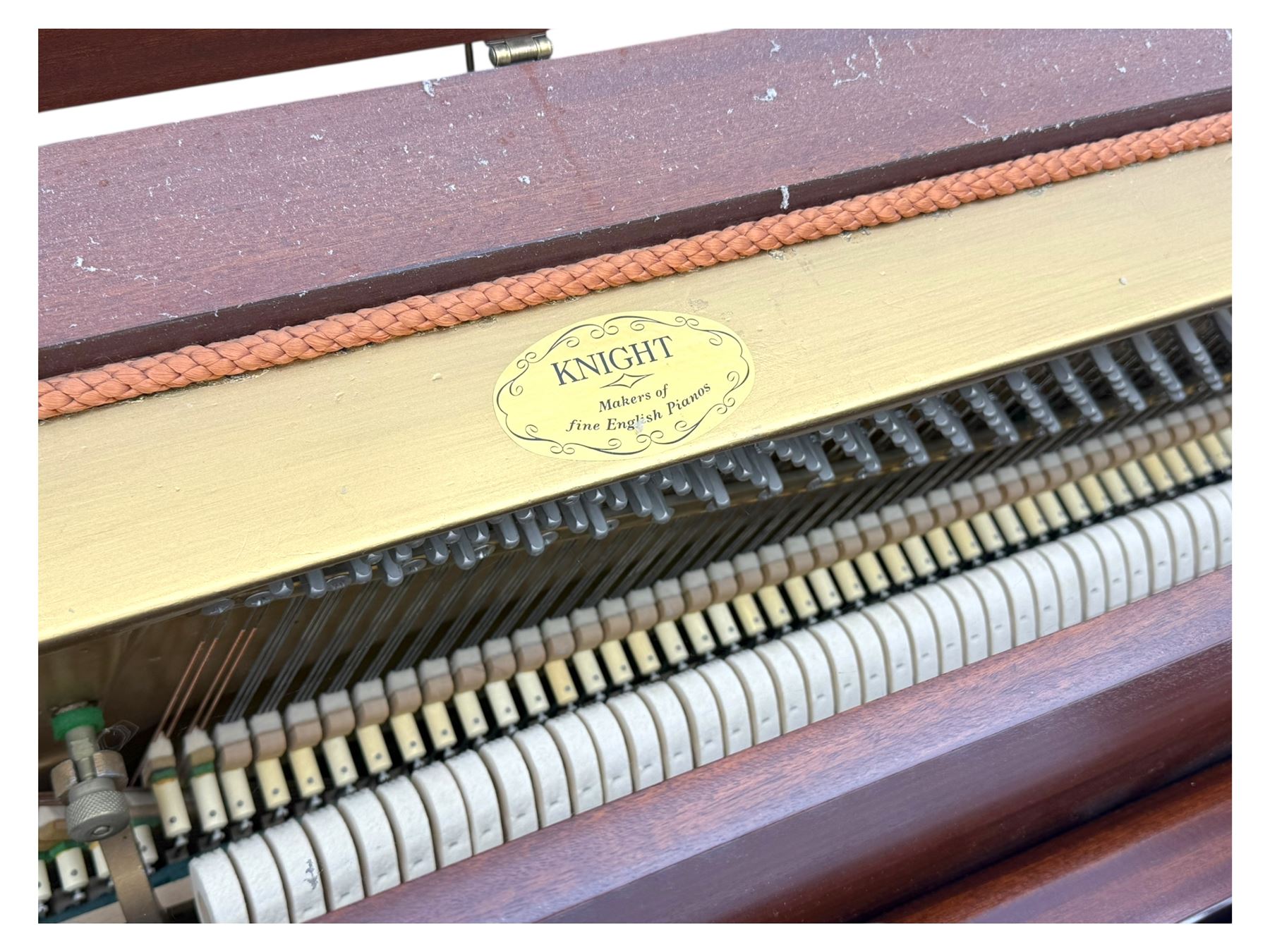 Knight - 20th century upright piano, in polished mahogany case with fall-front lid and twin brass pedals, complete with matching storage bench upholstered in brown fabric with receipt from Harrods (H 50cm x D 37cm W 95cm) 