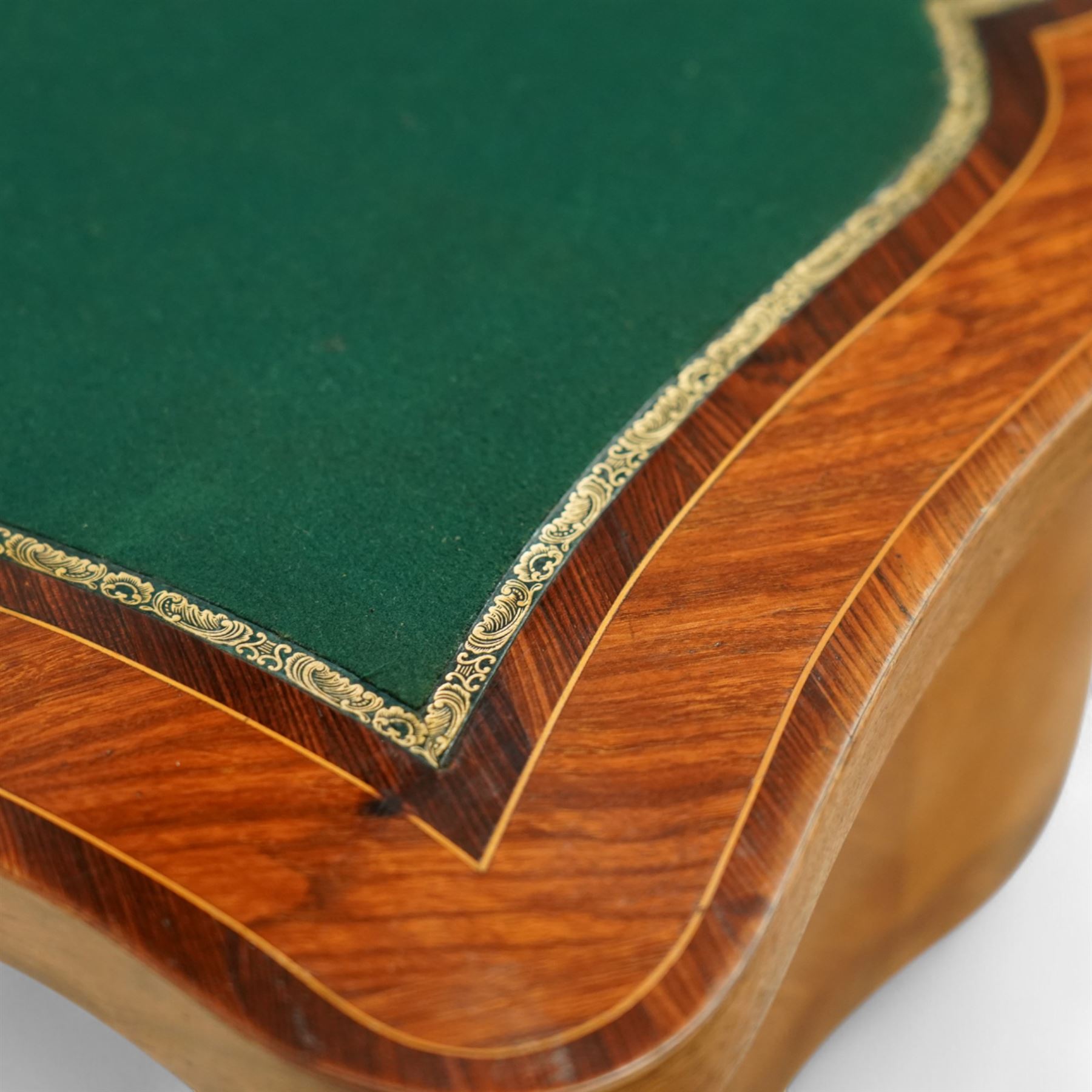 Early 20th-century Louis XV-style kingwood and tulipwood marquetry card table, shaped rectangular hinged top revealing baize-lined interior, with quarter-veneered parquetry within crossbanded borders and mounted with a gilt bronze edge, above a serpentine frieze,  raised on cabriole legs with gilt bronze foliate mounts and sabots 