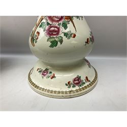 Large ceramic Jardiniere on stand, decorated with an oriental pheasant perched upon branches blossoming with peonies and foliage on white ground, overall H99cm
