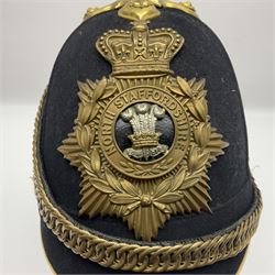 Late Victorian North Staffordshire Regiment Officer's Home Service Blue Cloth Helmet, having incorrect other ranks gilt metal Queen's crown helmet plate to the front with later leather backing, removable spike to the top on a shaped cruciform base with rosette fittings, rosette side bosses, brass trim to the front peak, and leather and velvet backed chin scales, with leather sweat band, the interior with makers stamp for Hawkes & Co 14 Piccadilly London