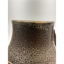 A Doulton Lambeth stoneware jug, with silver mounted collar, hallmarks rubbed, maker's mark probably Cornelius Desormeaux Saunders & James Francis Hollings (Frank) Shepherd, the leather effect body titled 'Drinke Faire Don't Sware', with impressed marks beneath including 'Manufactured for Sidney W Allen 39 White Rock Hastings', H18.5cm. 