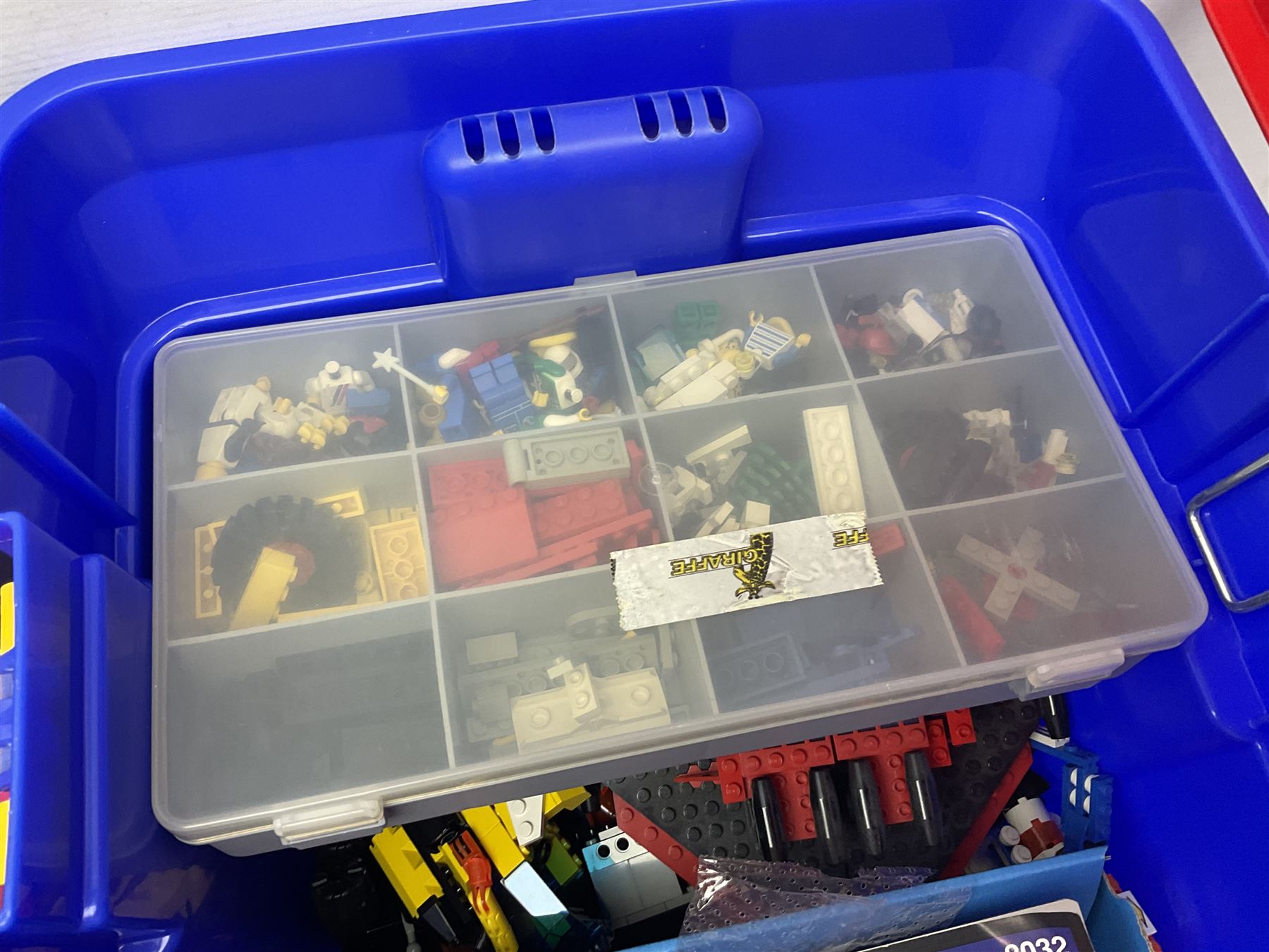 Lego - large quantity of part-built models and loose component parts including Lego Technic and Lego System, space and road vehicles, ships and boats, helicopter etc; together with two set boxes and folder  containing large quantity of instruction booklets; stored in two very large plastic boxes