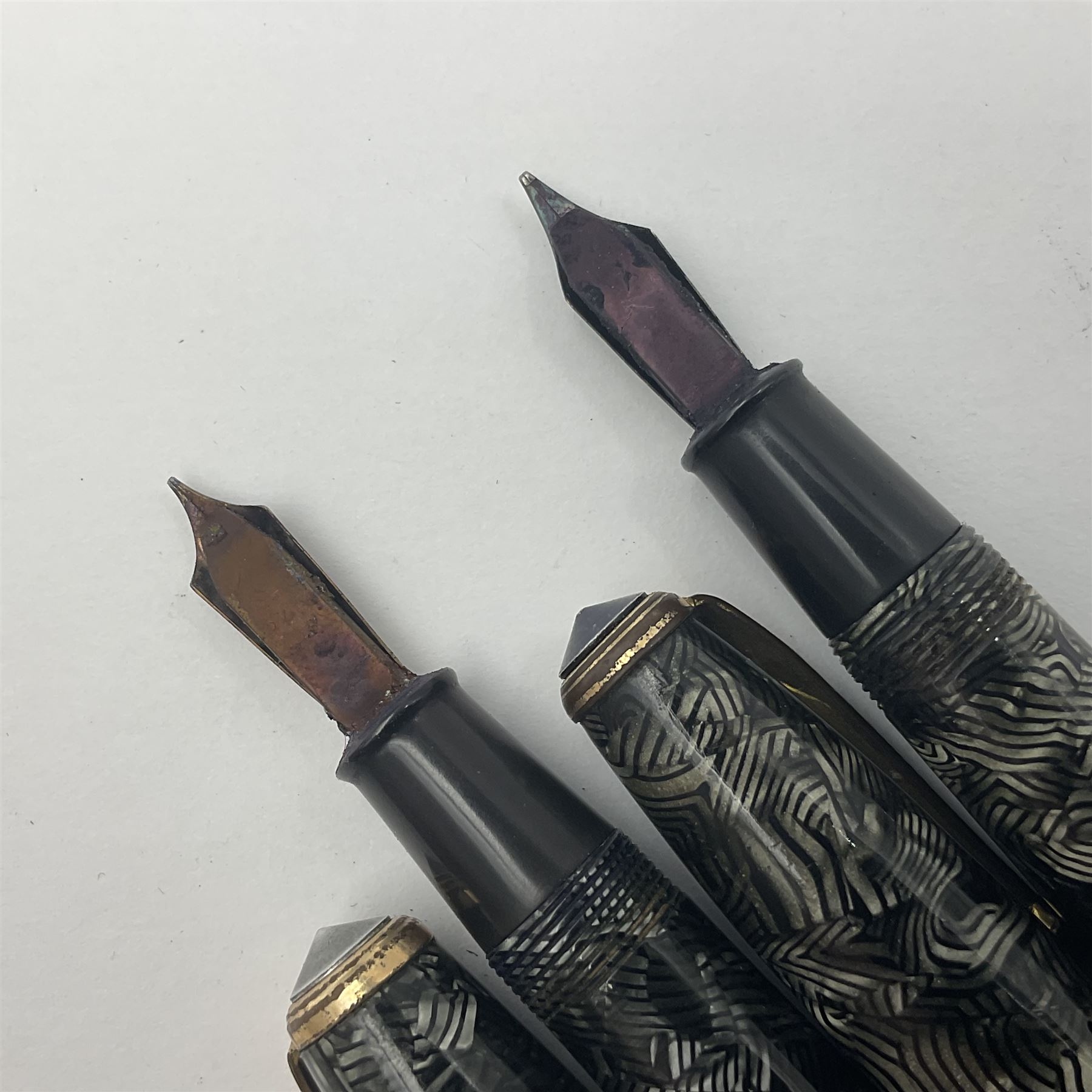 Conway Stewart Executive 60 fountain pen, the barrel and cap with hatched grey and black marble decoration and gold nib stamped Duro 14ct, together with a Conway Stewart 58 fountain pen similarly decorated in pearl blue and black with gold nib stamped 14ct, largest 13cm (2)