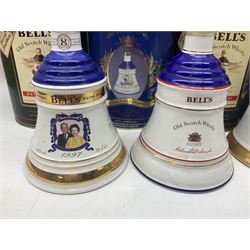 Bells, Scotch whisky, in seven Wade ceramic decanters, comprising two Christmas decanters 1990 and 1991, 60th birthday of Queen Elizabeth II decanter, Golden Wedding anniversary of the Queen and the Duke of Edinburgh decanter, Birth of Princess Beatrice decanter, Birth of Princess Eugenie decanter and Queen's mothers, together with Bells, blended Scotch whiskies, three miniatures in Wade ceramic decanters, various contents and proofs
