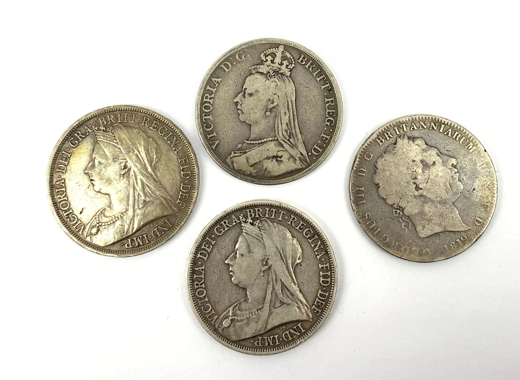 King George III 1819 crown coin and three Queen Victoria Crowns, one dated 1891 and two 1893 (4)