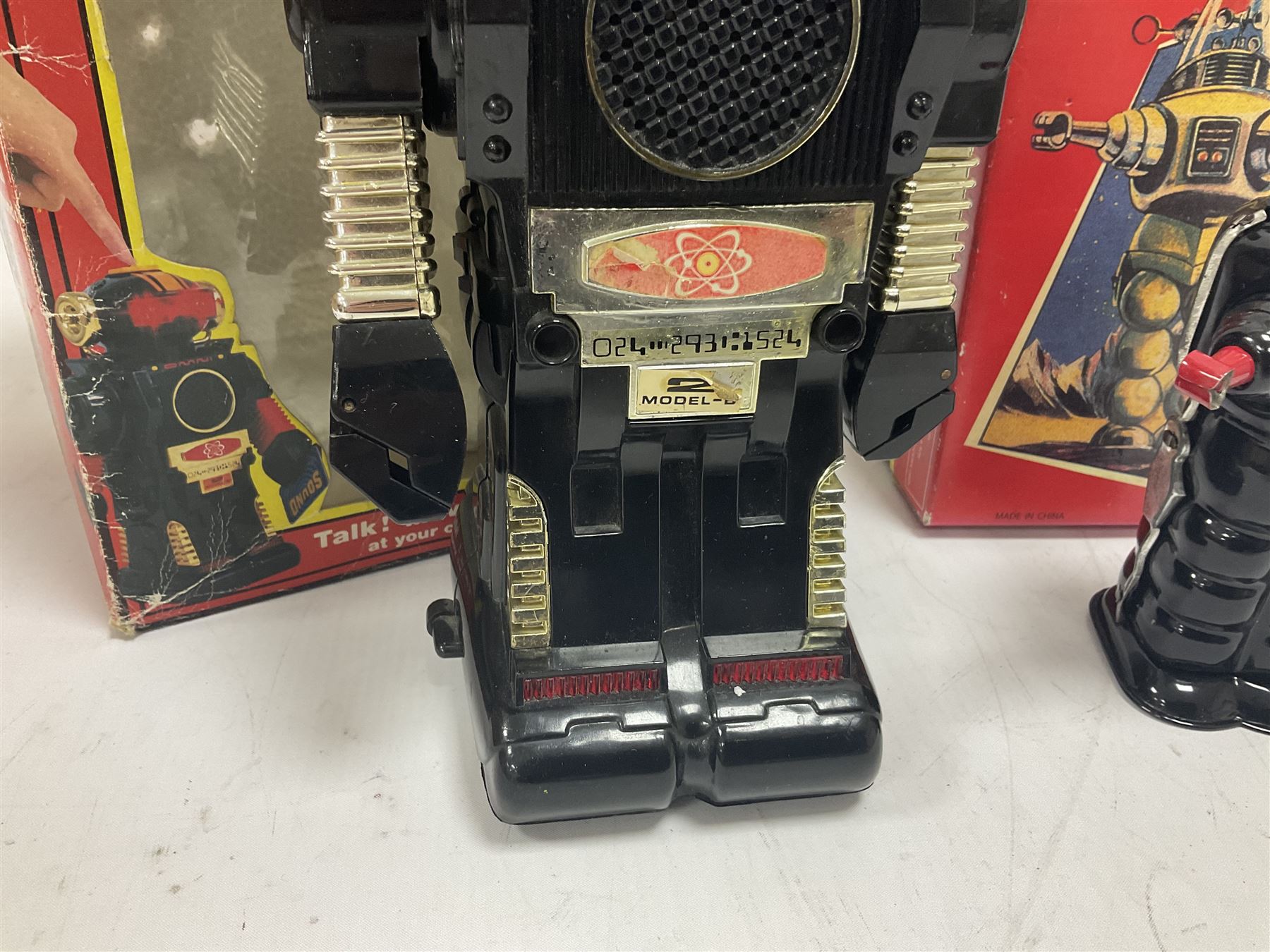 Three vintage battery operated robots comprising tin-plate Space Walk Man ME 100 Robot, Saturn the 13