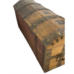 19th century painted oak sea chest, hinged dome top enclosing small compartment, bound by shaped and pressed metal strapwork, scumbled finish to resemble oak and painted with small vignettes depicting portraits and landscapes within panels, fitted with large wrought metal carrying handles, the front inscribed 'H.J.S. 1870' 