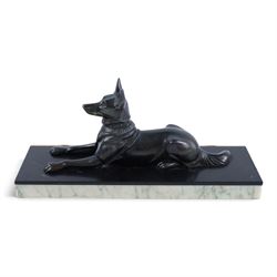 French Art Deco spelter figure of a recumbent dog on marble and onyx plinth, H14cm, L30cm
