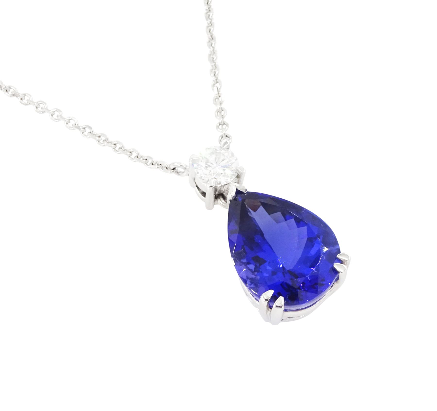 18ct white gold tanzanite and diamond necklace, single pear cut tanzanite of approx 7.60 carat, suspending from a single round brilliant cut diamond of approx 0.45 carat, to a fine belcher link chain necklace, hallmarked