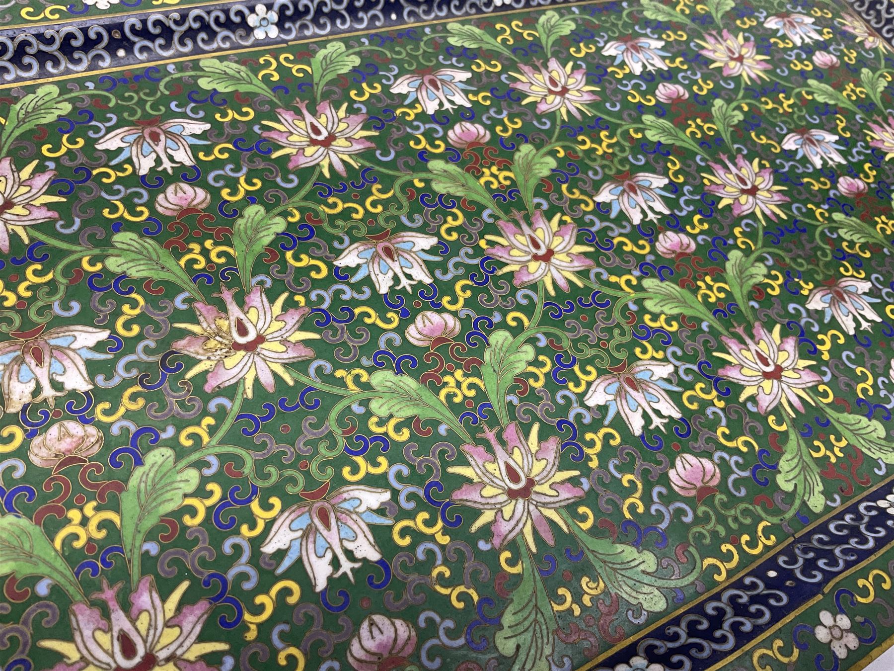 20th century Chinese cloisonne enamel smoking set, comprising two ashtrays, box and tray, with floral and foliate scrolling on green ground