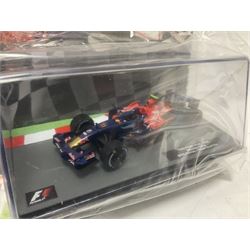Panini Formula 1 The Car Collection - twelve die-cast models including ten in unopened packaging with periodical; all models in plastic display boxes; and eight other boxed die-cast models of racing cars by Corgi, Onyx, Classico, Minichamps etc (20)