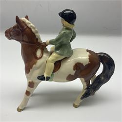 Beswick Boy on Palomino Pony no 1500 and Girl on Skewbald Pony no 1499, both with printed mark beneath 