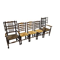 Harlequin set of nine country elm and beech chairs - pair 19th century spindle back carver armchairs with wingbacks, and a mixed set of seven ladderback side chairs, all with rush seats