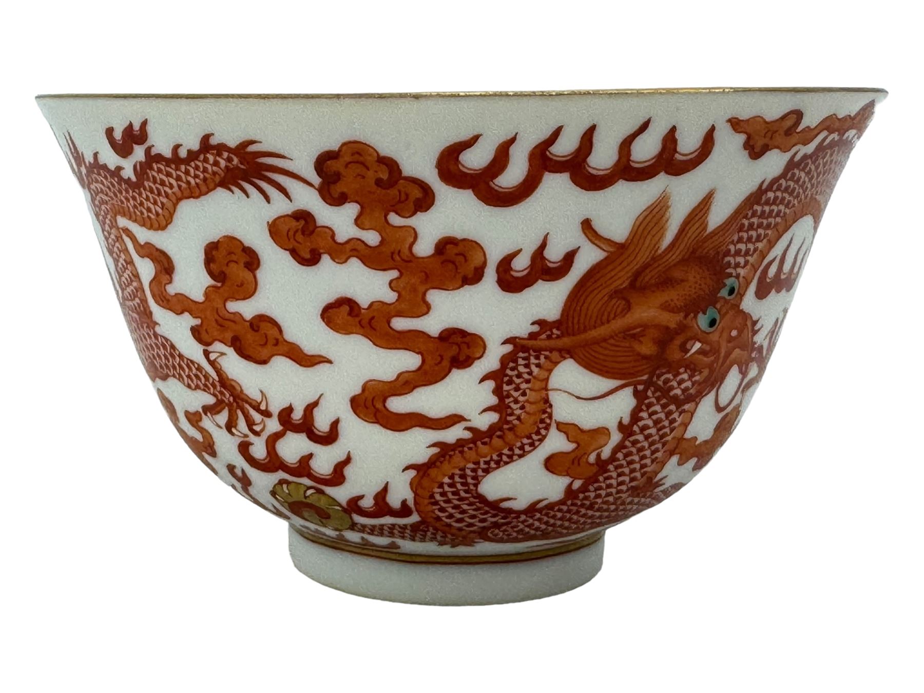 Chinese porcelain iron red tea bowl, the exterior painted with two five claw dragons chasing the flaming pearl, amidst clouds, red Quinlong seal mark beneath, D10.5cm x H6.5cm