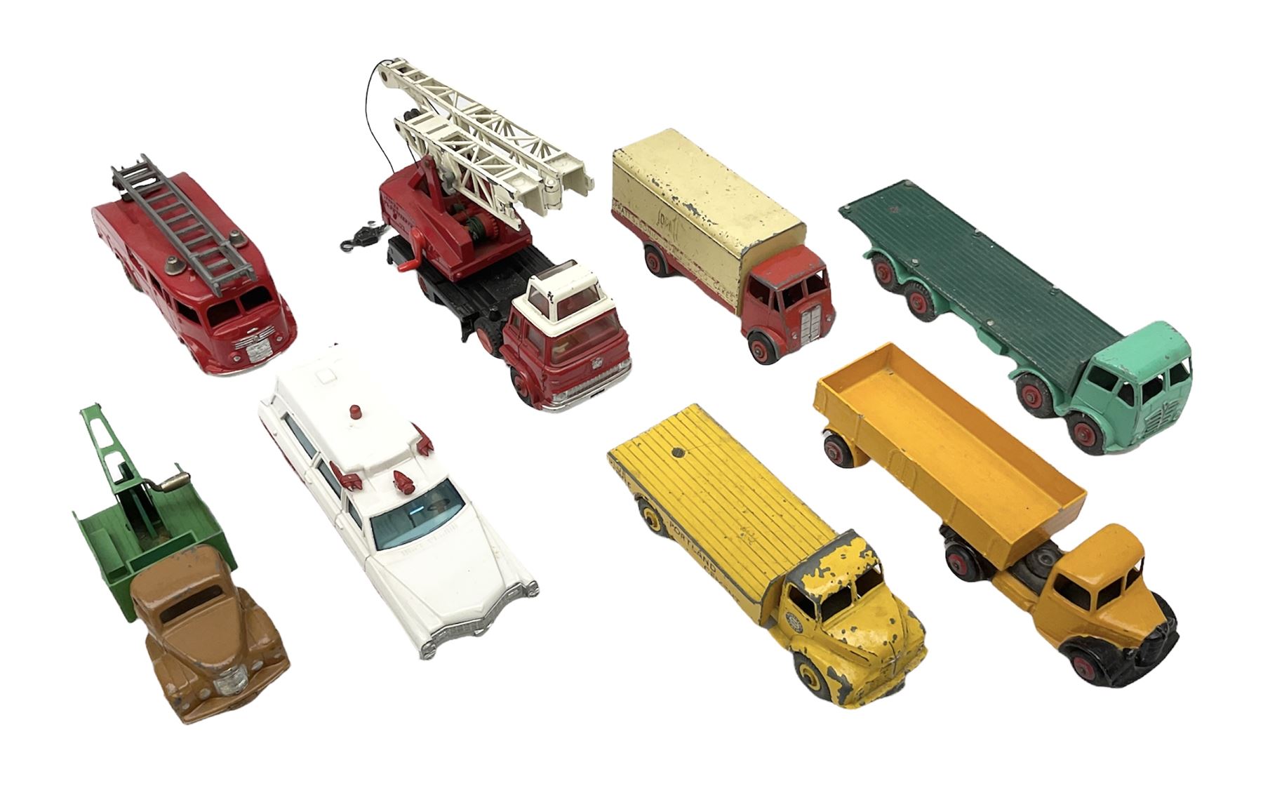 Dinky - eight unboxed and playworn/repainted commercial vehicles including Foden flatbed lorry, Bedford Articulated lorry, Leyland Comet Ferrocrete lorry, Guy Spratts panel van, Fire Engine, Jones Fleetmaster, Commer breakdown truck etc (8)