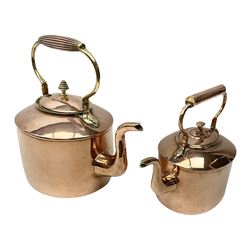 Two 19th century graduated oval seamed copper kettles, largest example H30cm